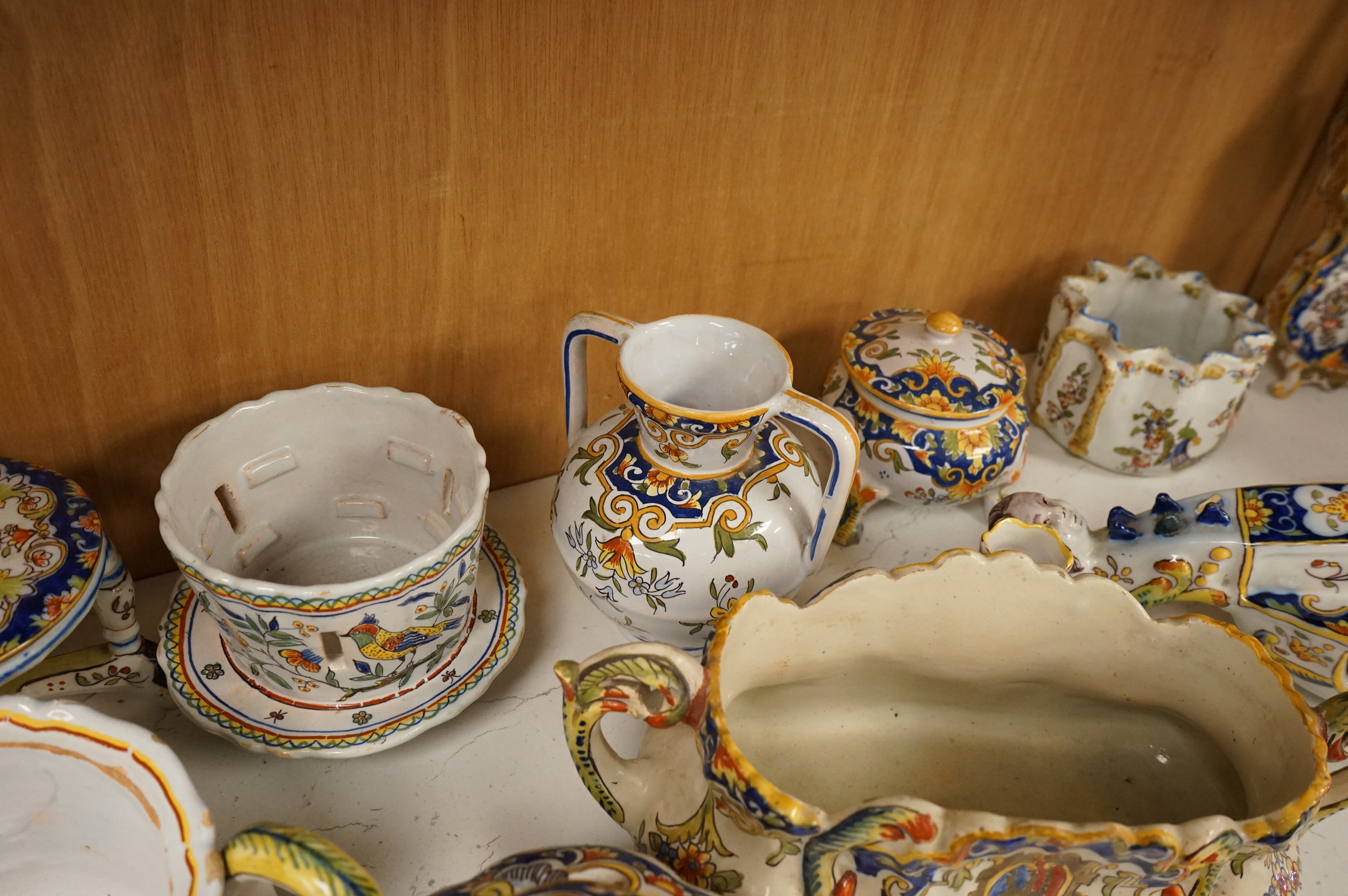 A group of French faience pottery to include trinket boxes, a teapot and vases, largest 32cm in length